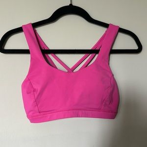 Lululemon Free to Be Serene criss cross back sports bra in color dark prism pink